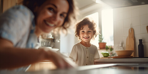 Close up portrait of cute boy with his mother in the kitchen,  cooking food together