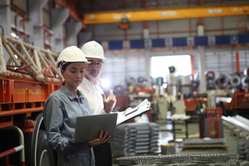 worker or engineer working in factory with safety uniform , safety hat and safety glasses , image is safety concept or happy workplace - 670214556
