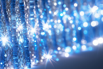 Fototapeta na wymiar Shiny tinsel borders in blue color. Christmas festive background. New year celebration. Generative AI