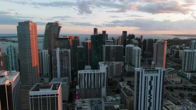 Aerial view of popular financial center Brickell in Miami with sparkling high-rises and contemporary buildings. Urban skyline at dusk