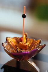 A pleasant evening with a delicious appetizer, a buffet table with appetizers and a set of canap s with ham, bruschetta, pear, cheese, raspberries and other sweets.