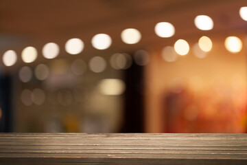 Perspective wooden table and bokeh light background. product display template