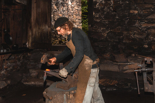 Blacksmith shaping a rare European mallet