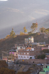 Very beautiful view of the city at sunset in the Mexican city of Guanajuato surrounded by large mountains.