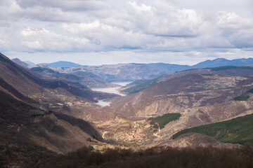 Unique view of Paklestica village and meandering Zavoj lake from a viewpoint on Old mountain, Serbia - 670228512