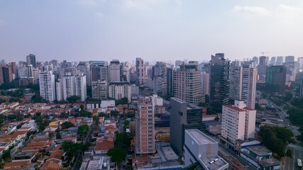 Fototapeta na wymiar Residential buildings and houses in the Itaim Bibi neighborhood in São Paulo, Brazil. Aerial view of Ibirapuera Park with buildings in the background.