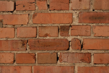 Old-aged brick wall grunge texture pattern. Red brick background. Brick tiles facade.