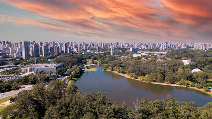 Fototapeta na wymiar Aerial view of Ibirapuera Park in São Paulo, SP. Residential buildings around. Lake in Ibirapuera Park