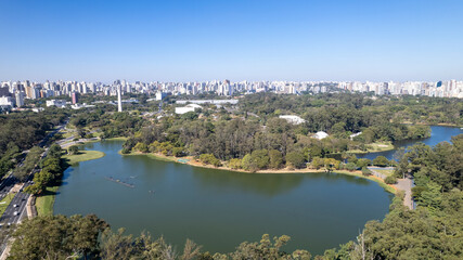 Fototapeta na wymiar Aerial view of Ibirapuera Park in São Paulo, SP. Residential buildings around. Lake in Ibirapuera Park