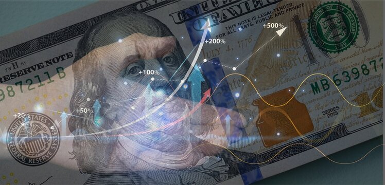 Billete de 100 d&oacute;lares con un gr&aacute;fico mostrando evoluci&oacute;n econ&oacute;mica