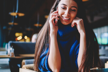 Cheerful young female student consult on cellular phone with 4g connection