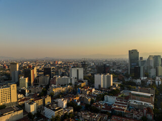 Naklejka na ściany i meble Beautiful aerial view of the capital of Mexico city of Mexico City at sunset.
