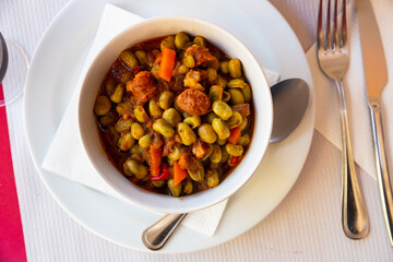 Habas a la Catalana, stew of beans with blood sausage, chorizo and bacon seasoned with paprika