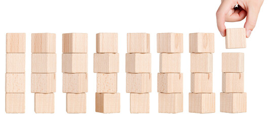 four wooden cubes from different angles with hand on white background, isolated background close up