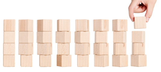 four wooden cubes from different angles with hand on white background, isolated background close up