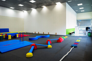 Colorful Gymnastic Equipment in Modern Training Room Kid's Physical Development Zone