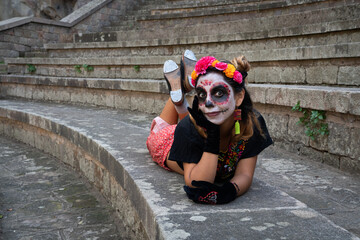 Young woman dressed as a catrina for day of the dead celebtarion