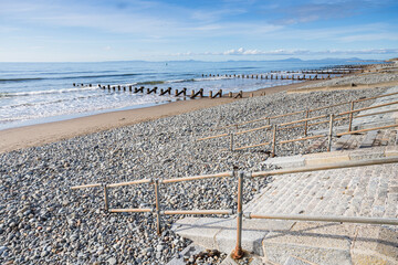 Railings and steps lead down to Barmouth beach