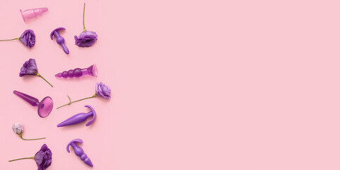 Beautiful flowers and sex toys on pink background with space for text