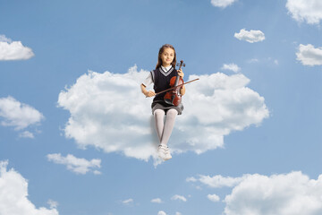 Schoolgirl sitting on a cloud and holding a violin