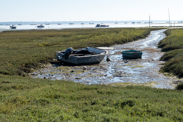 View on Arcachon Bay at low tide with many fisherman's boats and oysters farms, Cap Ferret...