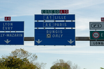 Highway road signs Paris, driving in heavy traffic on ring road of capital of France, traffic jam...