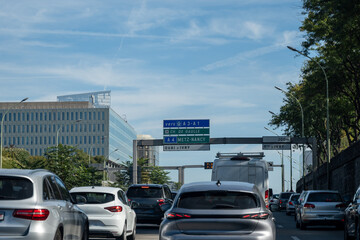 Driving in heavy traffic on ring road of capital of France, traffic jam problems in Paris