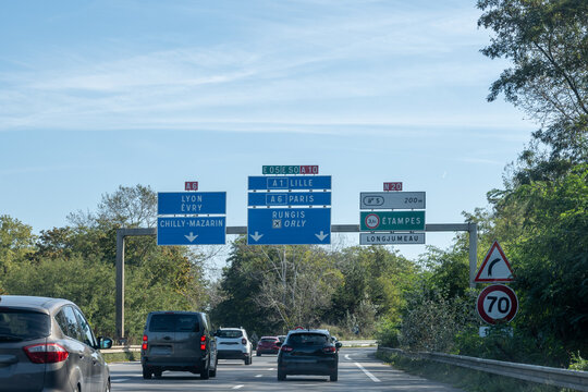 Highway road signs Paris, driving in heavy traffic on ring road of capital of France, traffic jam problems in Paris