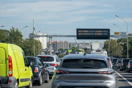 Driving in heavy traffic on ring road of capital of France, traffic jam problems in Paris
