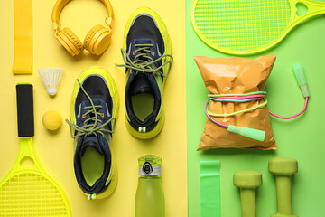 Composition with healthy snack, stylish sneakers and sports equipment on color background