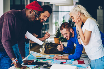 Fototapeta premium male and female multiracial crew satisfied with productive brainstorming session on job