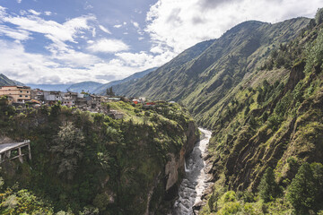 Magnificent view of the river and mountains in a deep canyon in the city of Banos, Ecuador.