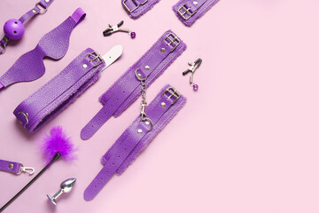 Different stylish sex toys on purple background