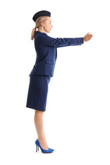 Young stewardess on white background