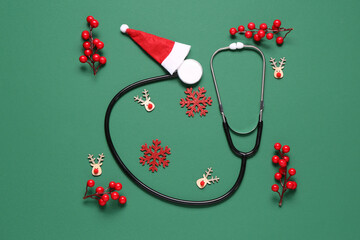 Christmas composition with stethoscope, Santa hat, berries and snowflakes on green background
