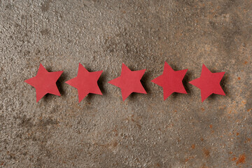 Five stars rating on rusted metal background. Customer experience concept