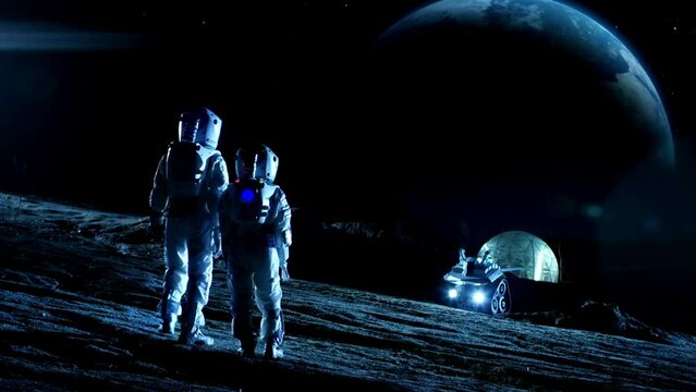 Two Astronauts in Space Suits Stand on the Moon