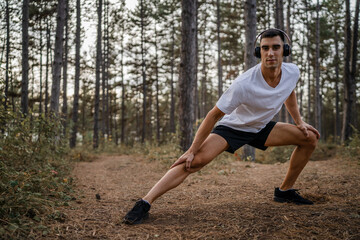 one man male athlete stretch in nature