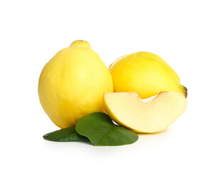 Fresh quinces with green leaves on white background