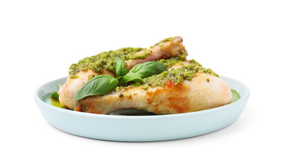 Delicious fried chicken drumsticks with pesto sauce and basil isolated on white