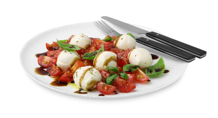 Tasty salad Caprese with tomatoes, mozzarella balls, basil and cutlery on white background
