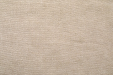 Fototapeta na wymiar Texture of beige blanket as background, top view