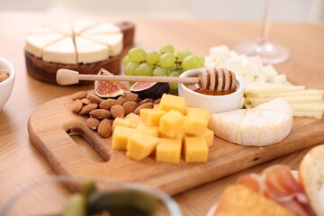 Assorted appetizers served on wooden table, closeup