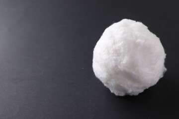Ball of clean cotton wool on grey background, space for text