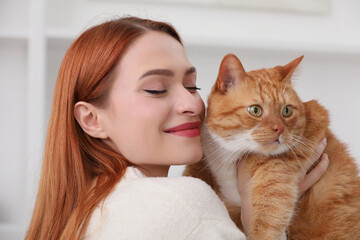 Woman with her cute cat at home