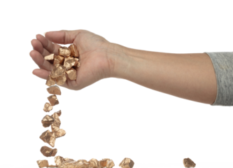 Gold ore nugget fall from industrial Miner hand fingers. Many pieces Golden nugget ore stone gravel found in hand of gold Mining industry. White background Isolated throwing freeze stop motion