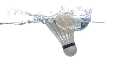 Badminton shuttlecock ball falls into water and creates air bubbles on surface. Badminton shuttlecock feather drop hit smash to clear water and deep to bubble. White background isolated freeze motion