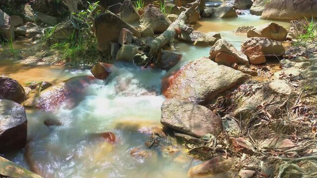 Fresh River Water Flowing With Natural Rocky Expanses, In Daya Baru Village, Indonesia