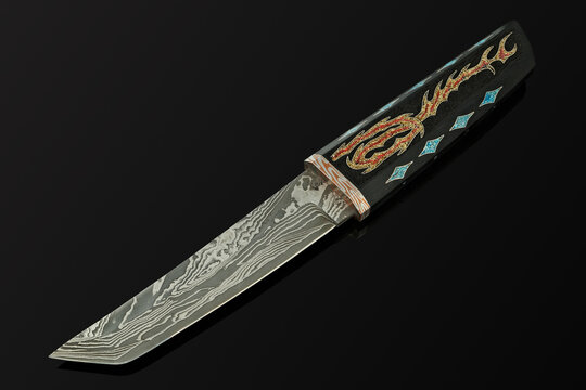hand-forged Japanese samurai knife tanto with inlays in the form of hieroglyphs in black dener on a black background