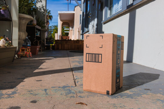Amazon Cardboard package delivery at front door. Los Angeles CA, November 11/22/2017: Image of an Amazon packages. Amazon is an online company and is the largest retailer in the world. 
